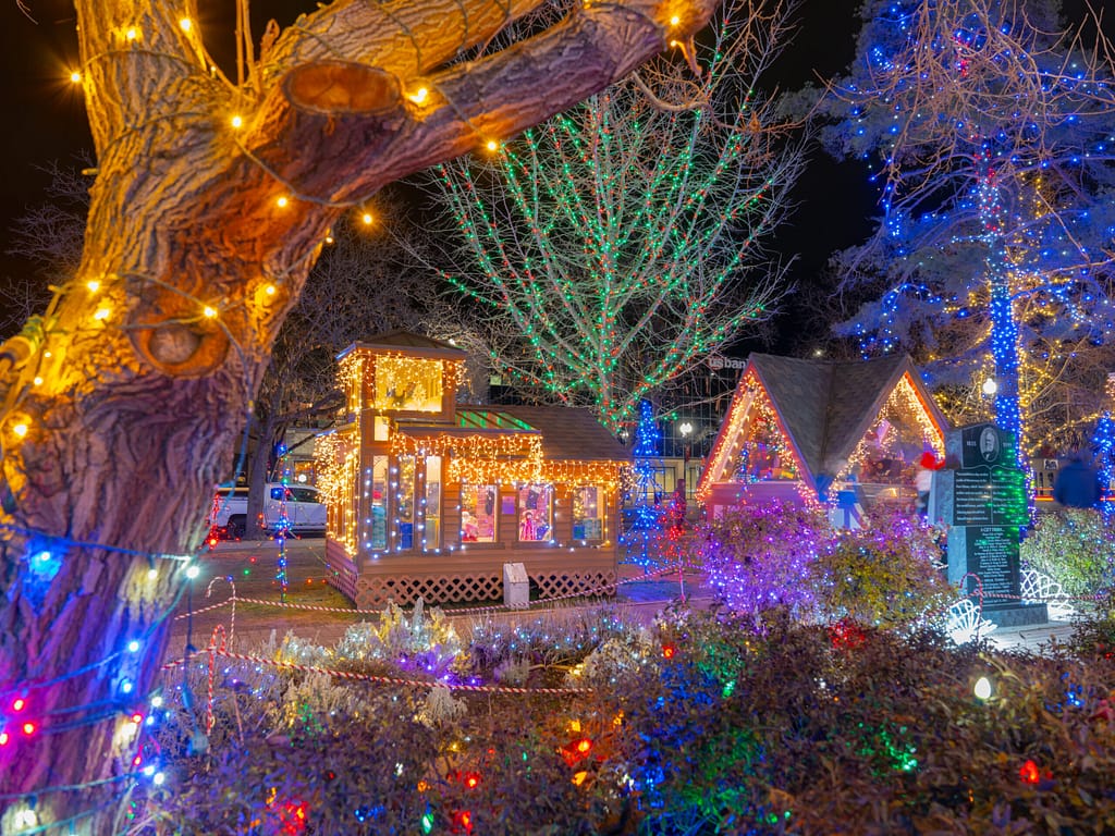 Ogden Christmas Village lit up with festive cottages and lights