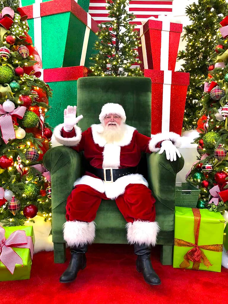 Families taking photos with Santa at a mall